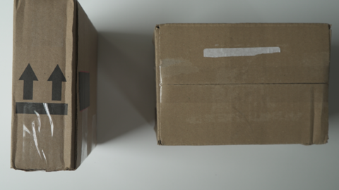 Photo of two shipping boxes from above