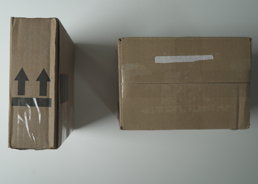 Photo of two shipping boxes from above