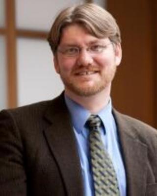 Portrait of Ian J Miller